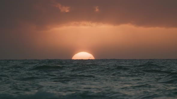 Sun On The Ocean Horizon With Waves