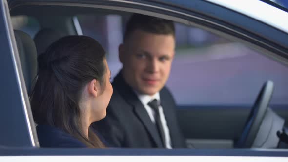 Handsome Man Hugging Pretty Woman in Car After Date, Romance and Sweetness