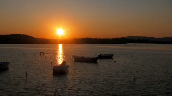 Time Lapse: Sunset with Sun and Fishing Boats