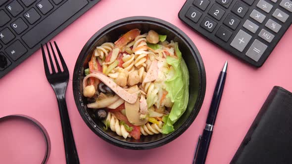 Fresh Vegetable Salad in Bowl on Office Desk