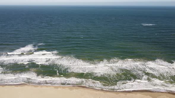 Aerial View of Sandy Beach and Sea Waves