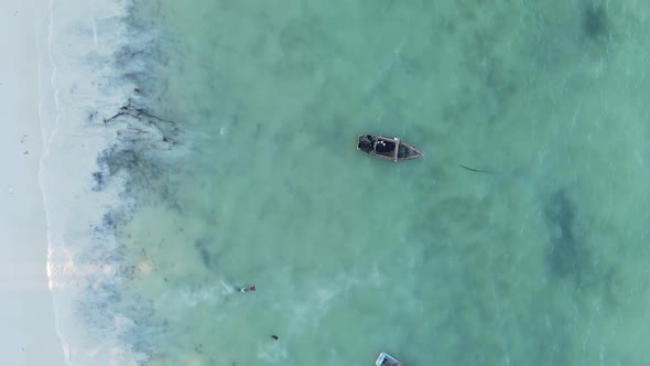 Vertical Video Boats in the Ocean Near the Coast of Zanzibar Tanzania Aerial View