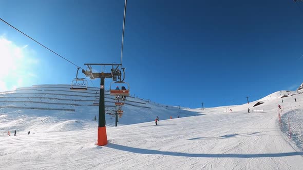 FPV POV of Cable Chair Ski Lift Ascend for Alpine Skiing in Dolomites Italy