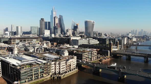 Aerial view of London's Financial District against the blue sky on a sunny day