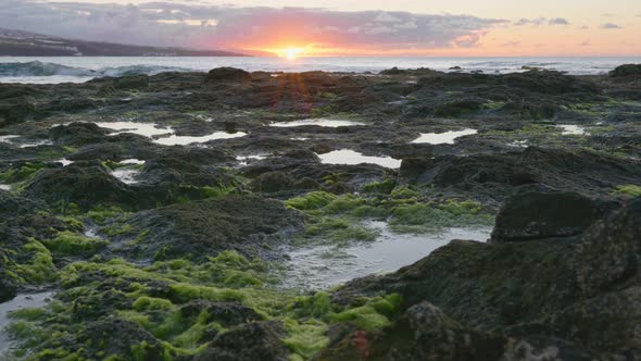 Sunset Sky Reflecting in Rocky Ocean Coast Pool. Beach Near Punta Del Hidalgo, Tenerife Island