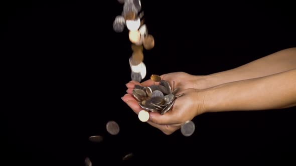 Hands Catching Falling Coins