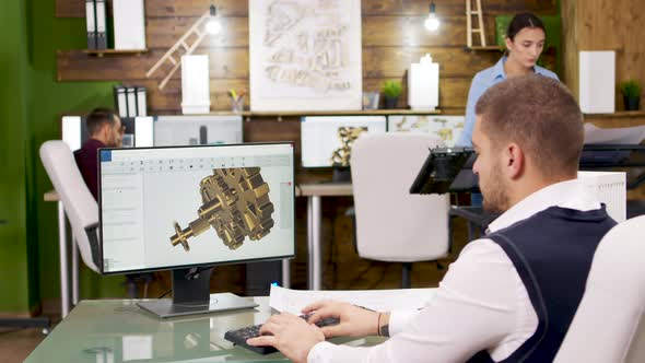 Construction Engineer Working on Building Mechanics on Computer