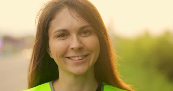 Portrait Video Young Smiling Girl in Light Green Vest