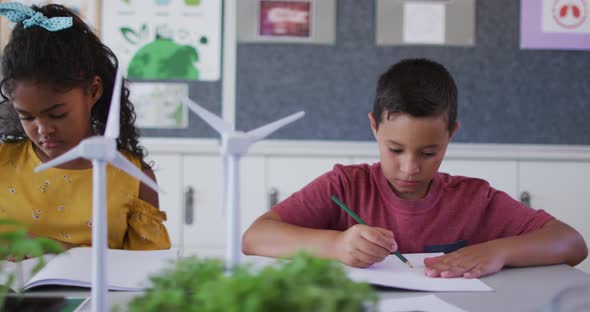 Diverse schoolchildren, learning about wind power and renewable sources of energy