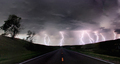 A composite image from 5 images of  cloud-to-ground lightening bolts at the end of a rural road, - PhotoDune Item for Sale