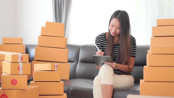 Woman with packing box ready for shipping