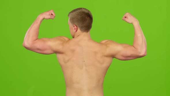 Man Sportsman Shirtless Showing Their Biceps, Back View. Green Screen