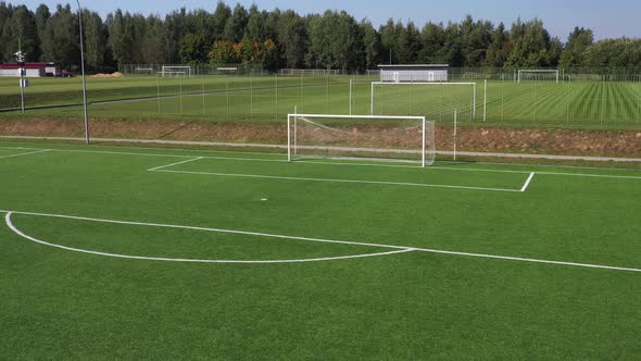 Top View of a Football Field with Green Grass Outdoors in Summer