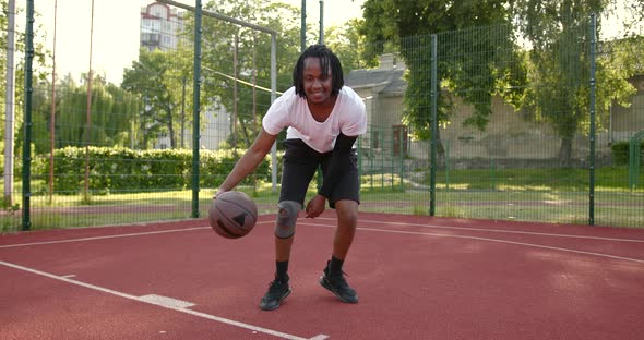 African American Man Does a Warmup Before Playing Basketball