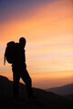 Hiker looking at the sunrise. - PhotoDune Item for Sale