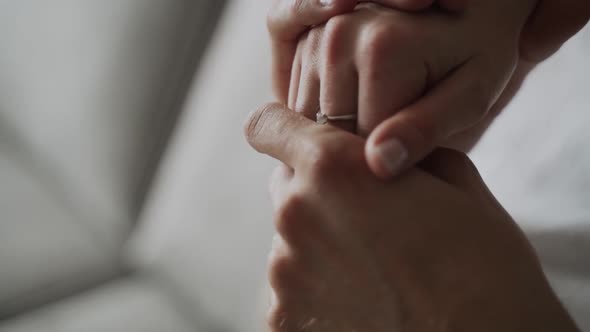 Closeup Caucasian Hands of a Man and a Woman Touching