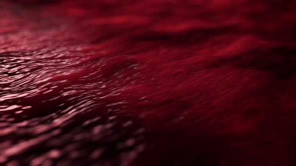 Colorful abstraction of moving red liquid substance