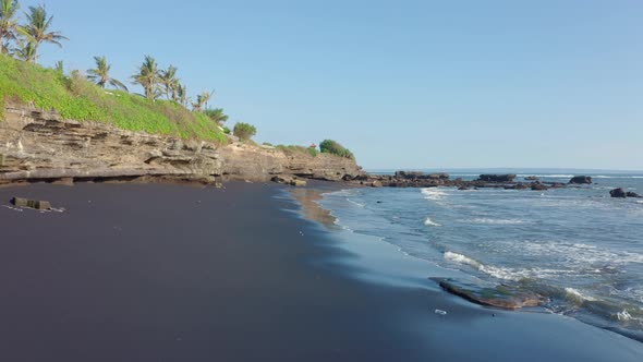 An Aerial View Beautiful Black Sand Volcanic Beach and Tropical Coast