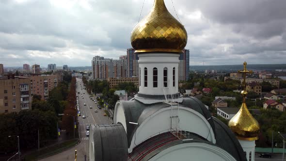 Kharkiv city cathedral aerial. Fly up, epic clouds