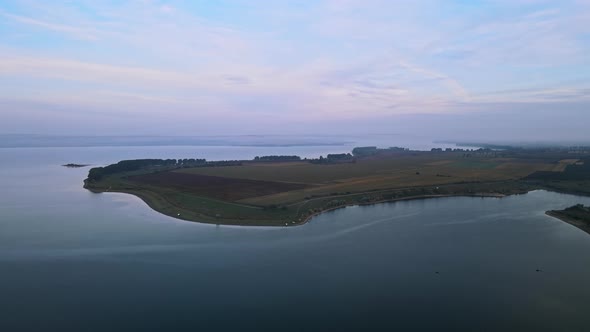 Aerial drone view of the Duruitoarea natural reservation in Moldova. River and fog in the air, field
