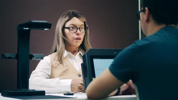 Humanlike Robot Is Talking To a Client in the Office