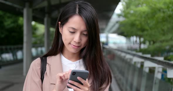 Woman use of mobile phone in city