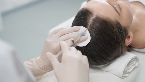 Woman Doing Special Procedure for Hair Restoration