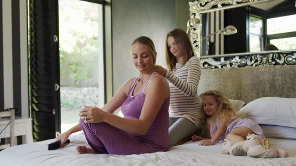 Daughter brushing the hair of her mother