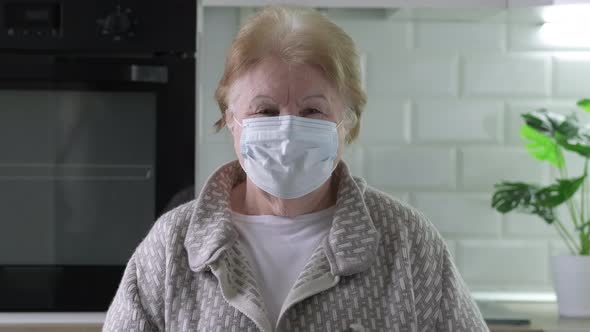 Video Portrait of Sad Senior Old Woman in Medical Mask During Quarantine Covid19 Pandemic Outbreak