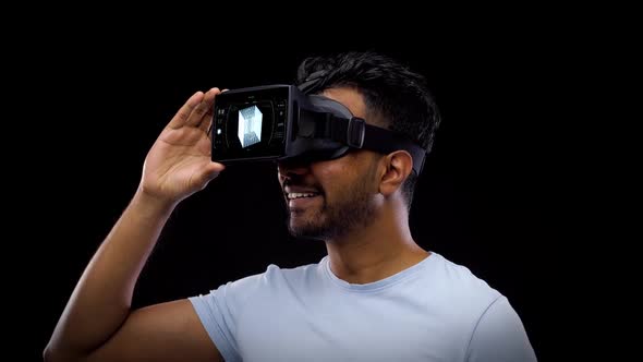 Man in Virtual Reality Headset with Cubic Hologram 7