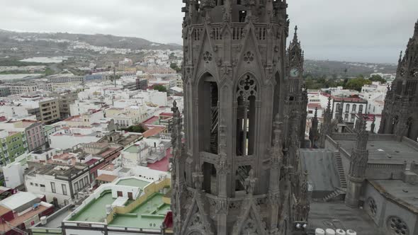 Close up of Neo-gothic style bell tower of Arucas Church in Canary Islands, Spain. Orbiting shot