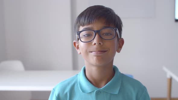 Positive Latin School Boy Wearing Glasses