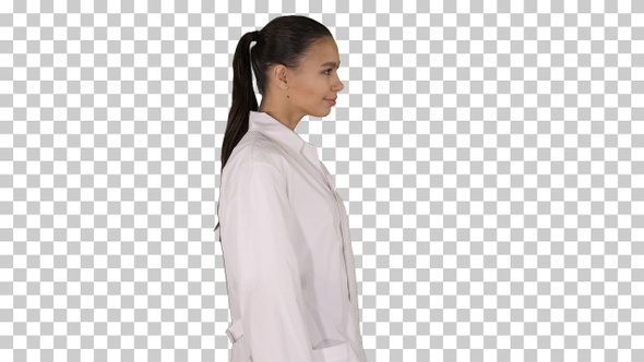 Doctor beautician in a white robe is walking, Alpha Channel