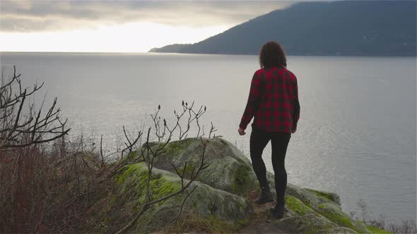 Adventurous Girl Looking at the Beautiful Scenery on the West Pacific Ocean Coast