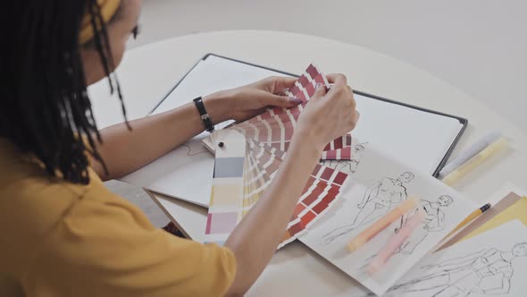 Female Fashion Designer Working with Color Palette