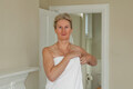 Mature woman wrapping towel around her - PhotoDune Item for Sale