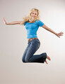 Smiling girl jumping in mid air - PhotoDune Item for Sale