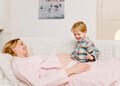 pregnant woman and boy laughing - PhotoDune Item for Sale