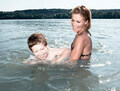 Mother teaching child to swim - PhotoDune Item for Sale