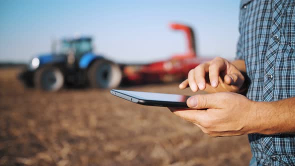 Farmer Using Digital Tablet