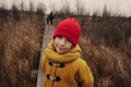 Autumn Portrait of Smiling Girl in Yellow Coat and Red Hat Hiking With Her Family - PhotoDune Item for Sale