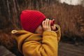 Child in Warm Yellow Winter Coat is Looking Through Red Binoculars - PhotoDune Item for Sale