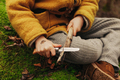 Hands of a Child Cutting Wooden Stick With a Pocket Knife - PhotoDune Item for Sale