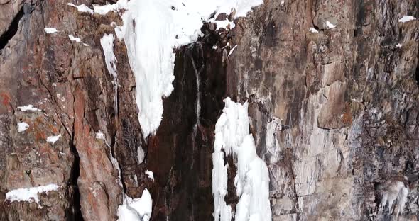 Freezing Waterfall in the Snowy Mountains