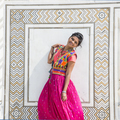 Young girl in traditional clothes in front wall of Taj Mahal in Agra, India. - PhotoDune Item for Sale