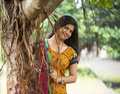 Happy woman near banyan tree - PhotoDune Item for Sale