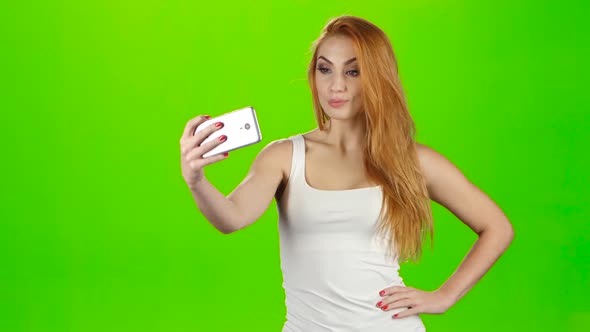 Girl Model Looks Poses for Selfie Photos on Mobile Phone