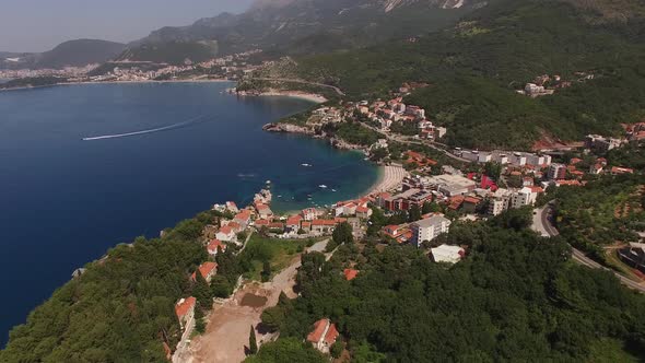 Drone View of Buildings Among Trees on the Sea Coast Montenegro