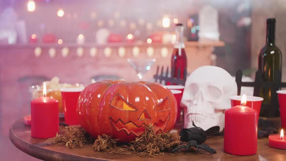 Carved Pumpkin As a Halloween Still Life and Other Decor Elements in a Bar