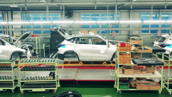 Side View of White Car Bodies Standing on Assembly Line. Automotive Industry, Automobile Production